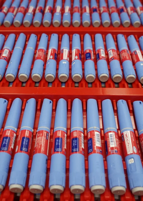 Scientific evidence is mounting that the new class of GLP-1 receptor agonist weight-loss drugs—such as Ozempic, seen here on a production line—seem to help diminish cravings for alcohol.