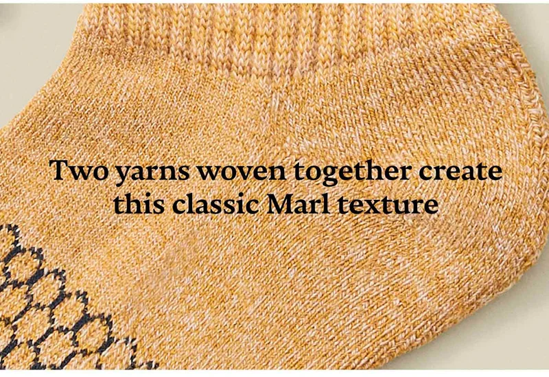 Two yarns woven together create this classic Marl texture