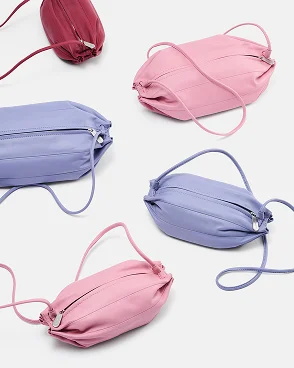 Scattered pink and purple karla bags.