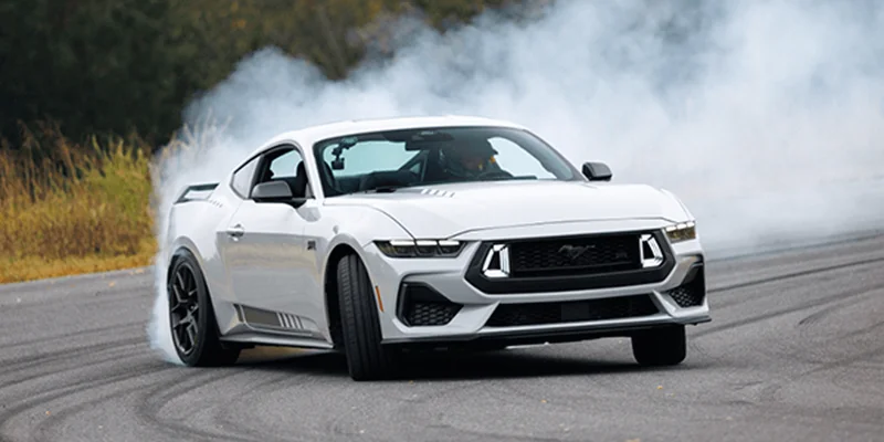 A Mustang® RTR model in a drift maneuver on a track