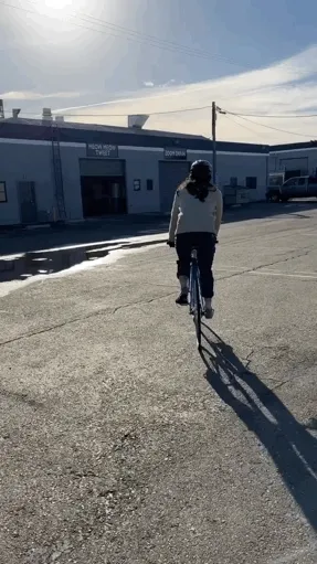 A video of Jeff riding their bike into the studio