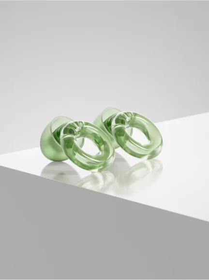 A pair of green Loop Engage earplugs.