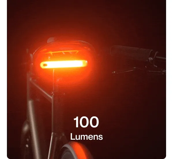 GIF of the Smart Light Pro Dual glowing bright red at 100 lumens on a bike seat post.