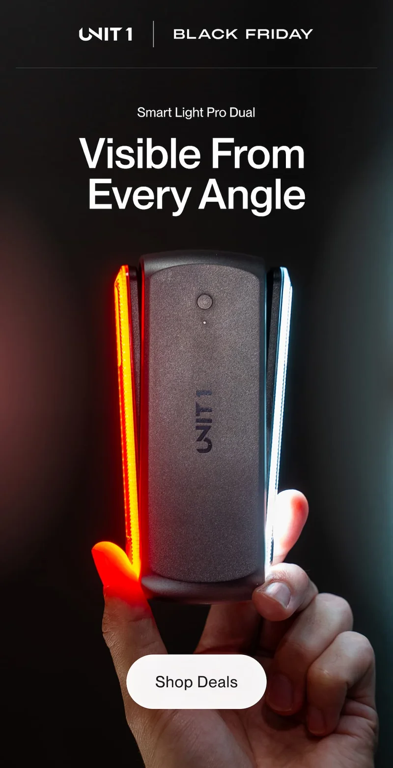 Smart Light Pro Dual held in a hand showing red and white side lights during the Black Friday promo.