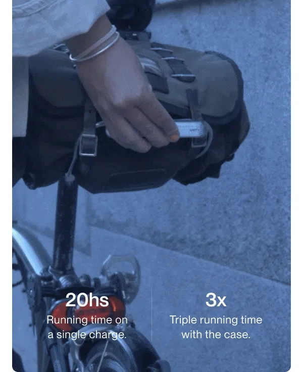 GIF showing a rider storing the Smart Light in the charging case with text highlighting 20 hours of use and 3x battery life.