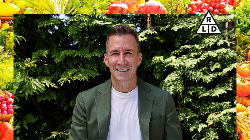 Image may contain: Yanic Truesdale, Face, Head, Person, Photography, Portrait, Blazer, Clothing, Coat, Jacket, and Plant