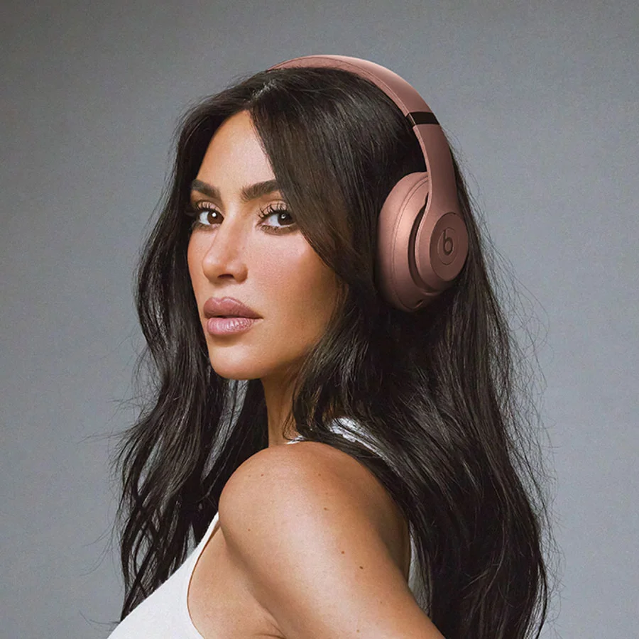 Kim Kardashian wearing Beats Studio Pro headphones in Moon
