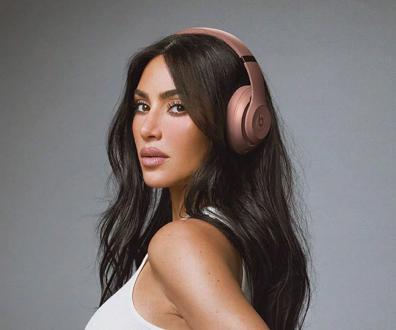 Kim Kardashian wearing Beats Studio Pro headphones in Moon