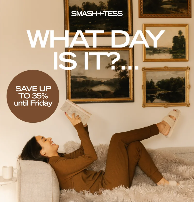 brunette wearing brown romper led on cream couch reading book with text WHAT DAY IS IT?...