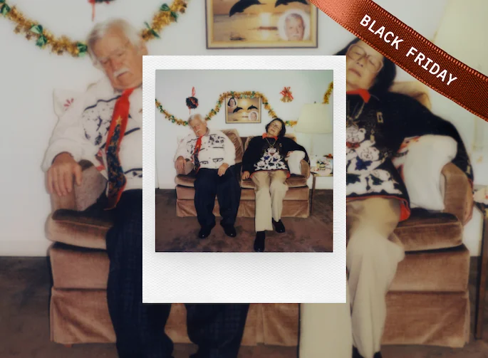 Polaroid photo of a sleeping couple on the couch