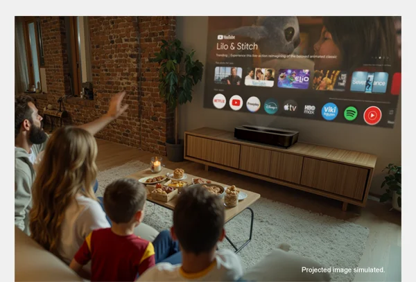 Image: a family sitting in a room together watching TV using the Epson Lifestudio Grand Plus