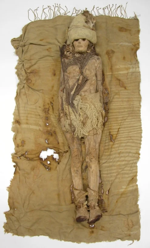 A mummy from China’s Xiaohe cemetery wears a necklace of cheese.