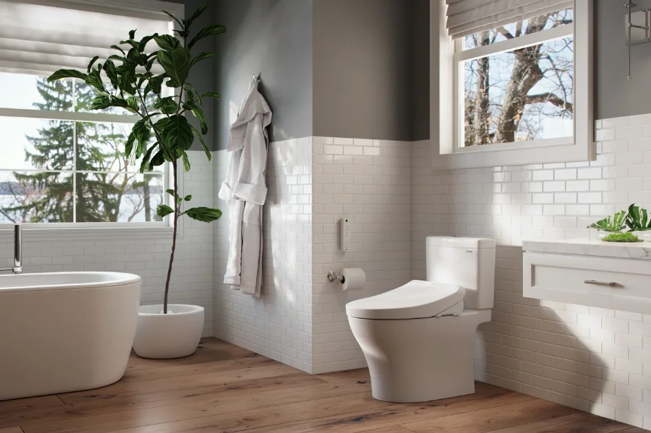A TOTO K300 WASHLET+ in a sunlit bathroom decorated with green plant life