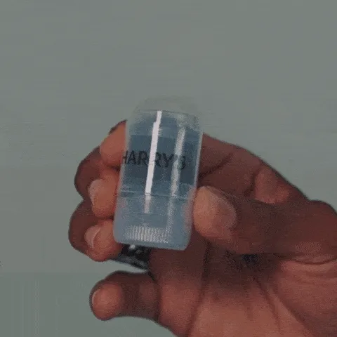 animated gif of hand holding re-hydrating stick and man using on his face