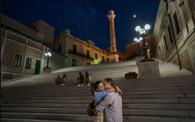A couple embraces at the Port of Brindisi in Italy. Scientists have shown that being in love activates the brain's reward center and can lead to measurable benefits such as reducing your stress and pain as well as improving your sleep and your problem-solving abilities. It is even linked to a longer life.