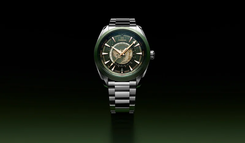 Seamaster Aqua Terra 150M Worldtimer with a green dial on a green background.