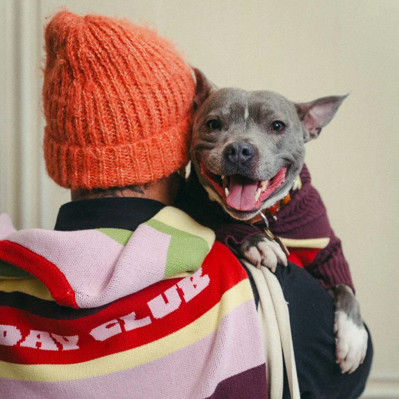 A man and his dog wearing matching Hox x Barc jumpers