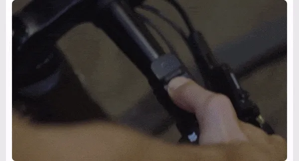GIF of a man riding his bike and indicating his turns