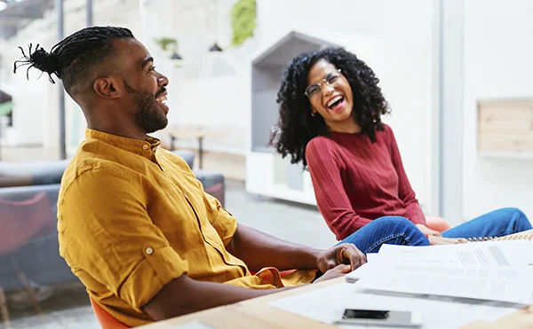 Laughing co workers in common space
