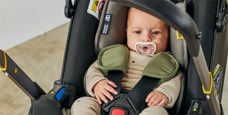 Baby in Doona car seat