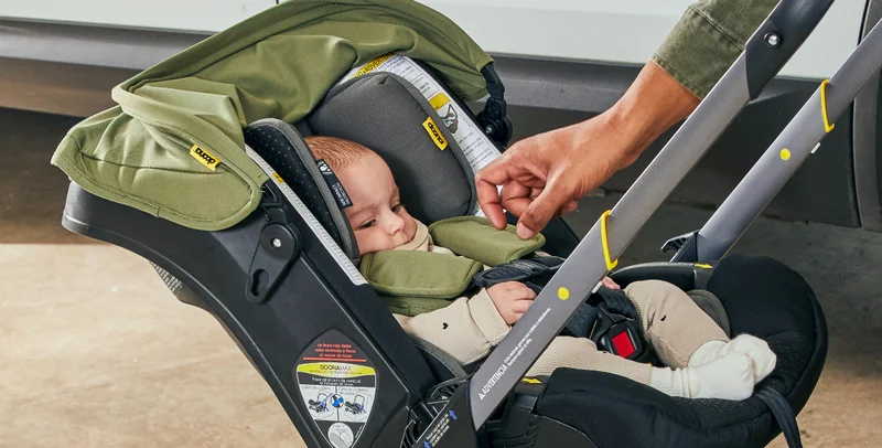 Baby in Doona car seat