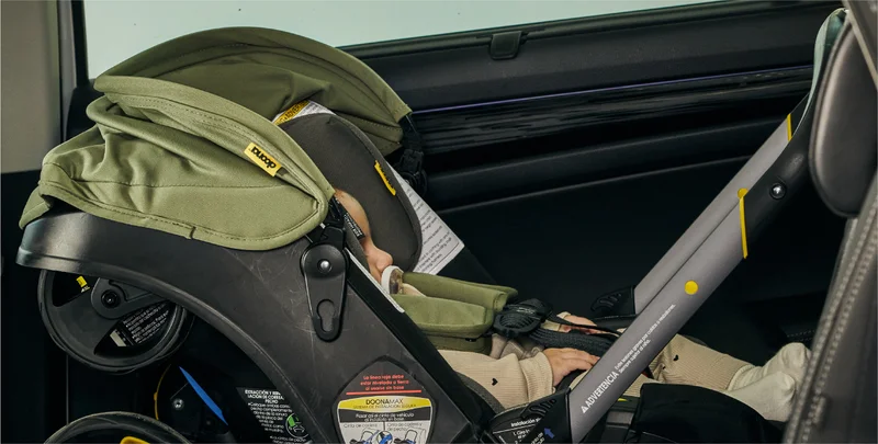 Baby in Doona car seat