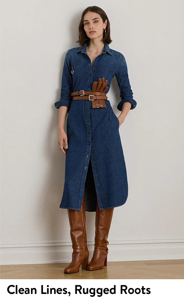 A woman wearing a denim midi dress with a brown leather belt and tall boots. A woman wearing a belted denim midi dress.