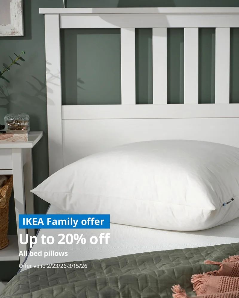 Woman hugging IKEA bed pillow