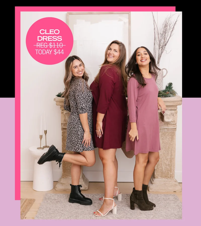 3 women stood in front of stone fireplace