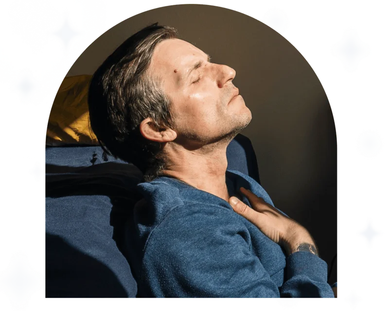 A mature man practices mindfulness in his bedroom