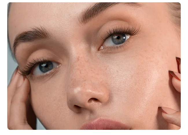 Close-up of model wearing natural dark brown lash clusters.