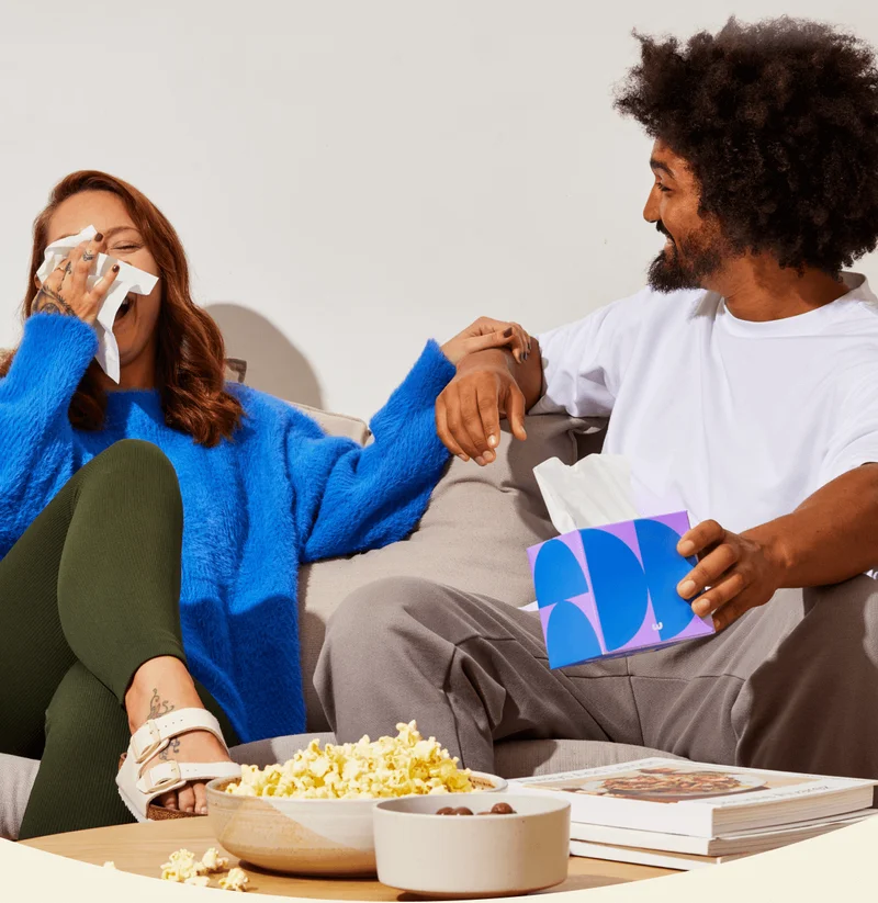 Image: Friends laughing and maybe wiping some tears away with our tissues during an emotional movie.