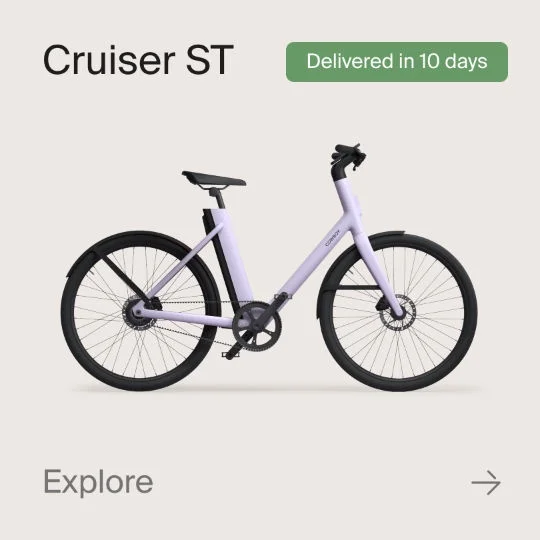 A graphic composition showing a Cowboy Cruiser bike. Text in the image reads "Cruiser ST", "Shipped in 10 Days" and "explore".