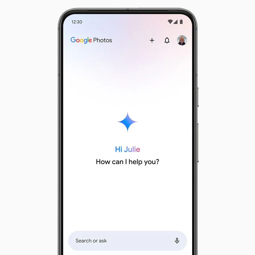 image of a smartphone with the words 'Google Photos' and 'Hi Julie, How can I help you?'