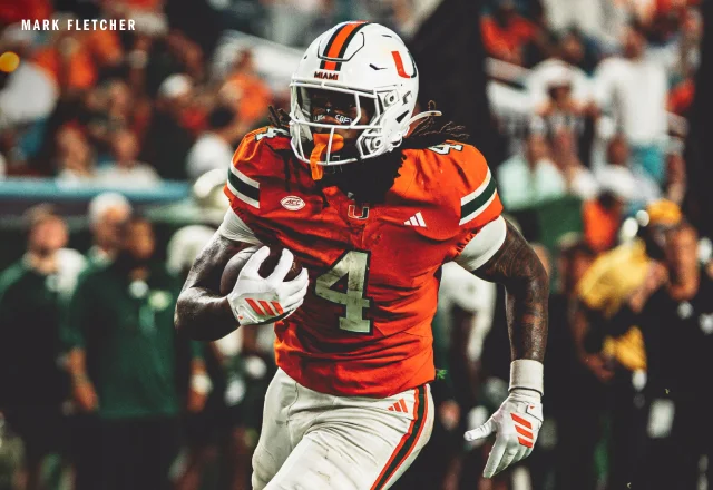 Miami Hurricanes running back Mark Fletcher running with a football