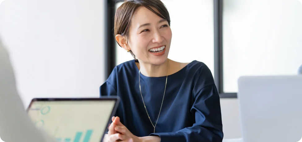 Person smiling in a meeting