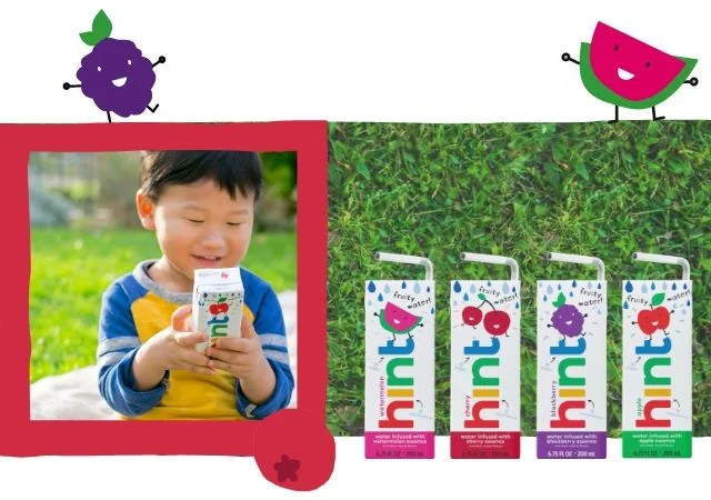 Child at a park with a pouch of Hint Kids