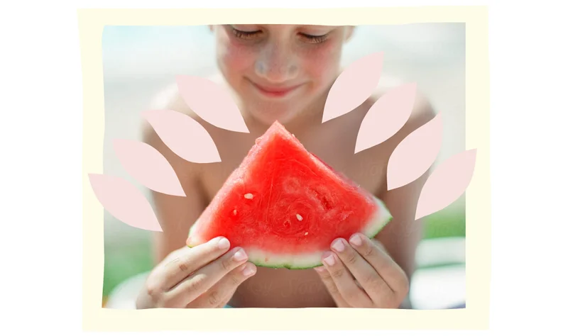 Child holds a slice of watermelon