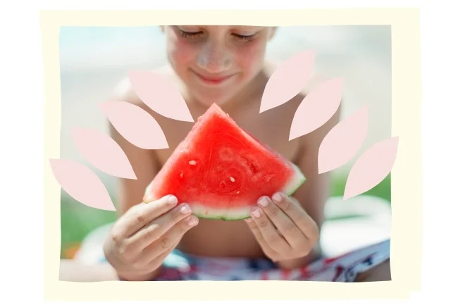 Child holds a slice of watermelon
