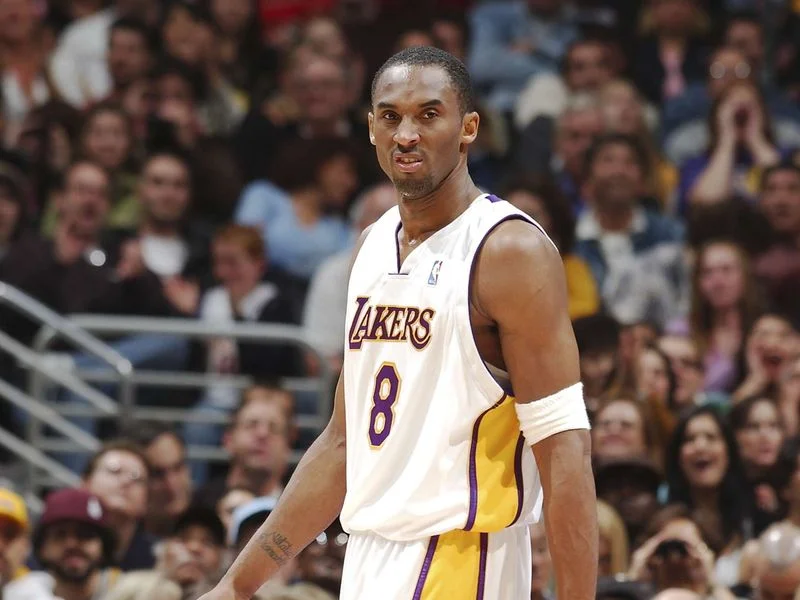 Image may contain: Kobe Bryant, Bill Kenney, La Parka, Zhang Zhongqi, People, Person, Adult, Baby, Clothing, and Footwear