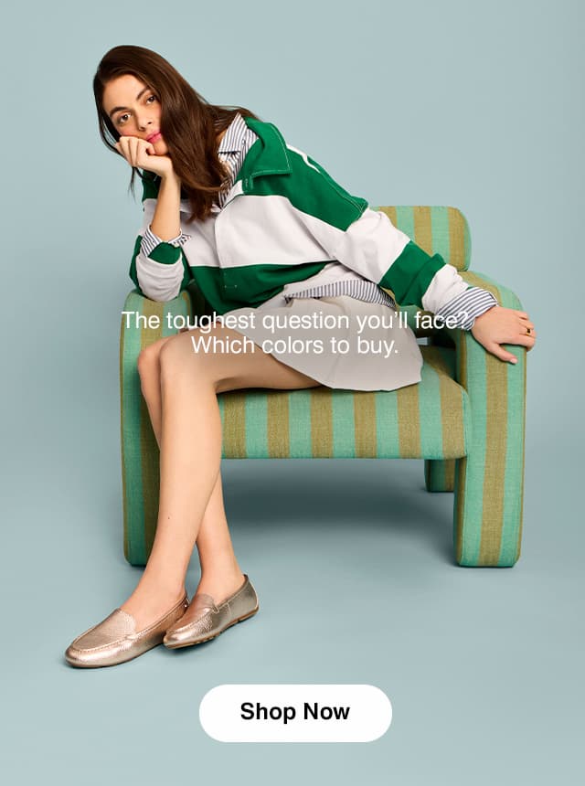 A woman sitting wearing a pinstriped shirt with a striped ruby shirt on top, a pleated mini skirt, and the Ozzie in Soft Rose Gold metallic leather. The email says The toughest question you’ll face? Which colors to buy. Shop Now.