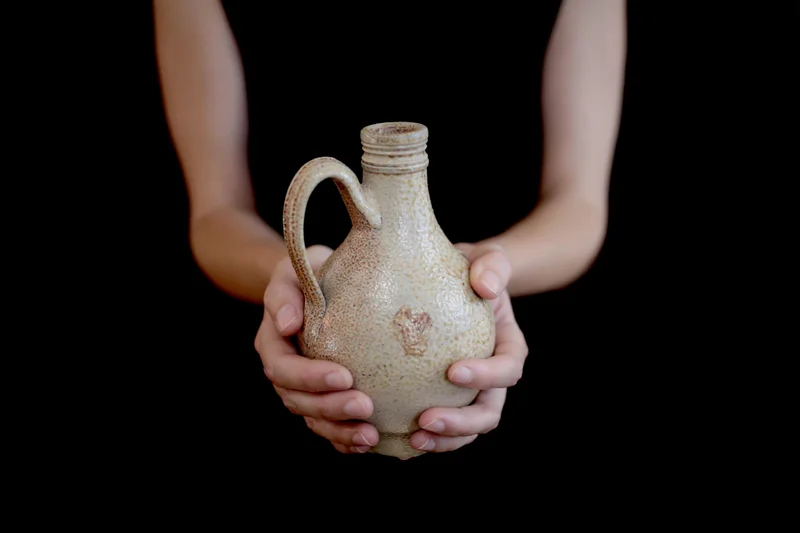 This pale, reptilian-patterned jug was excavated from a 17th-century privy—with eerie contents inside,
