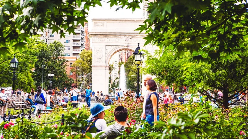 Image description: People walking through Washington Square Park in the West Village.