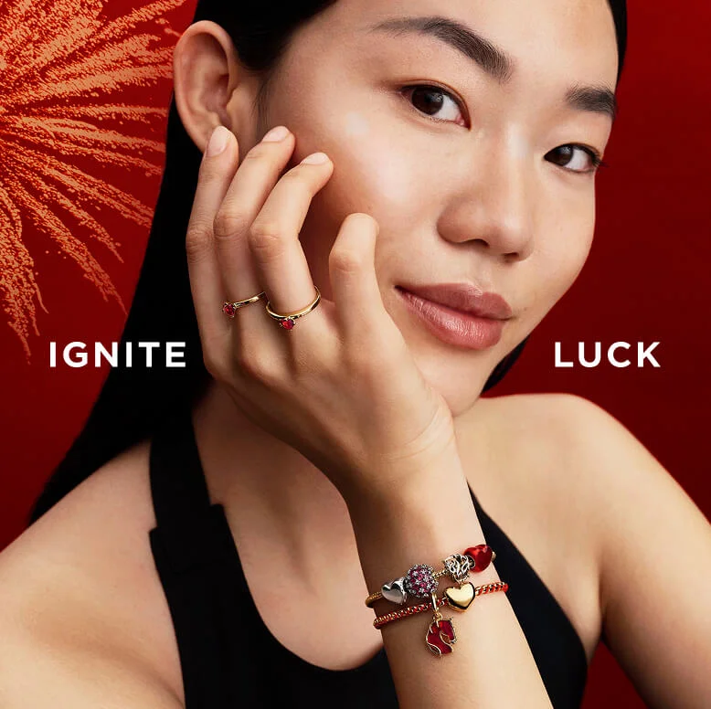 Year of the Horse charms, featuring openwork details and fire-red Murano glass