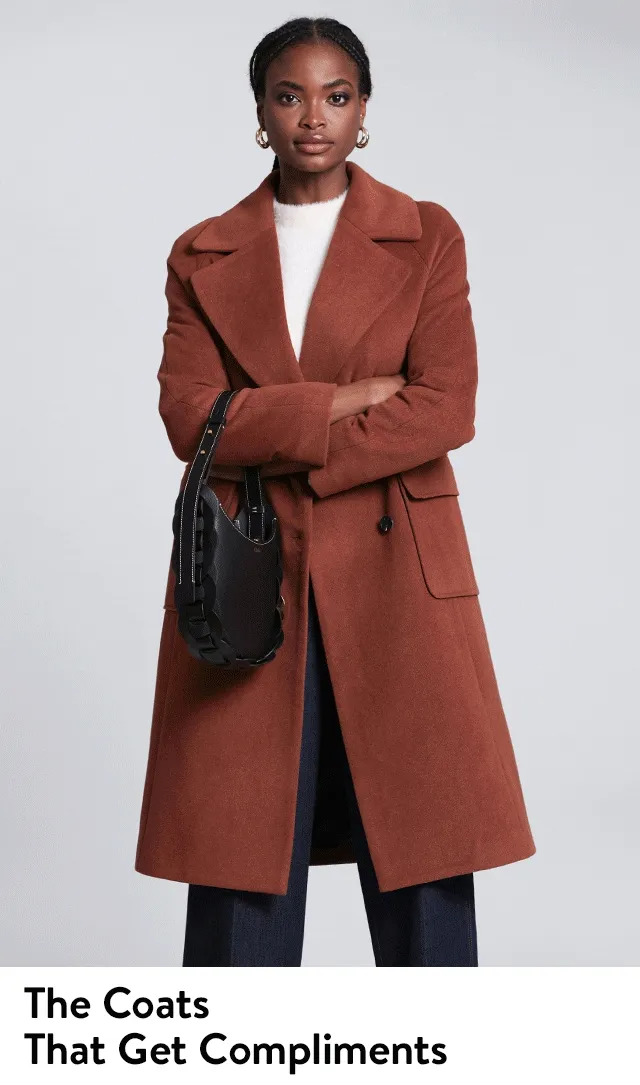 A model wears a brown double-breasted coat. A model wears a tan faux-fur coat. A model wears a black faux-fur coat.