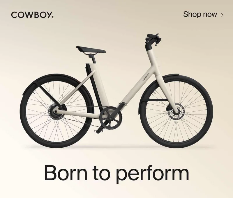 A graphic. A Cowboy Cruiser model is shown with the company logo. Text above the product reads "Shop Now", and a title text below reads "Born to Perform"