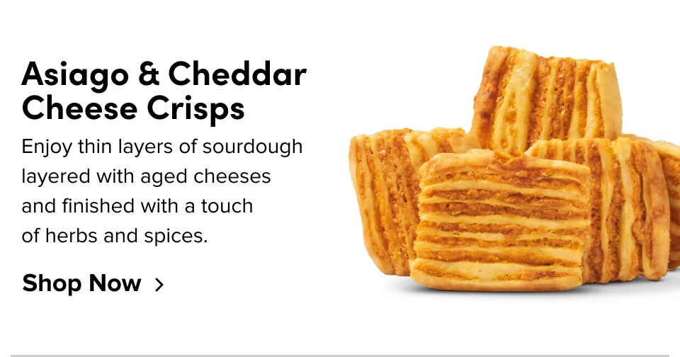 Asiago & Cheddar Cheese Crisps –&nbsp;Enjoy thin layers of sourdough layered with aged cheeses and finished with a touch  of herbs and spices; Shop now