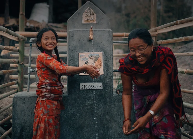 Graphic of tow women drinking clean water.