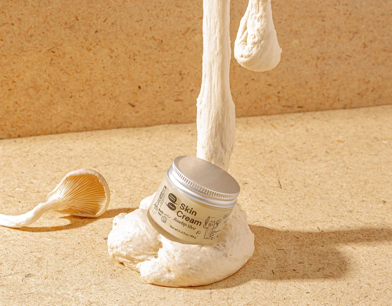 A tan jar sits on a leaking blob of sourdough