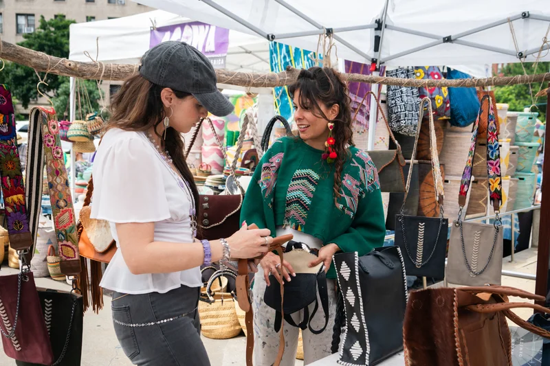 Two people shopping outside